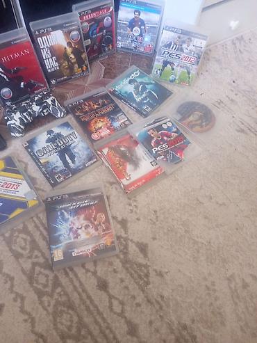 PS3 (Sony PlayStation 3): Игровая консоль Sony PlayStation 3 (модель Slim) с набором дисков — 3