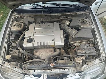 срочное: Mitsubishi Carisma: 1999 г., 1.8 л, Механика, Бензин, Седан — 7