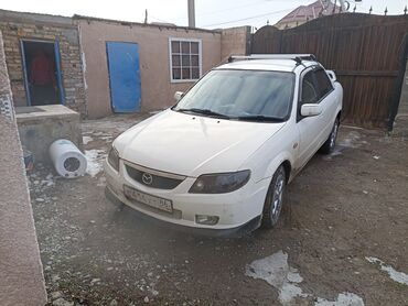 машина маленкий: Mazda 323: 2001 г., 1.5 л, Автомат, Бензин, Седан