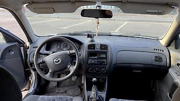 bmb e36: Mazda 323: 1999 г., 1.6 л, Механика, Бензин, Универсал — 10
