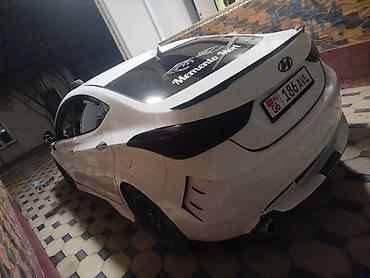 Тюнинг: Hyundai Elantra, белый седан с обвесом и тюнингом экстерьера — 2