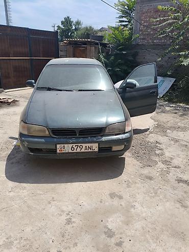 Продам легковой автомобиль седан темно‑зеленого цвета на киргизских