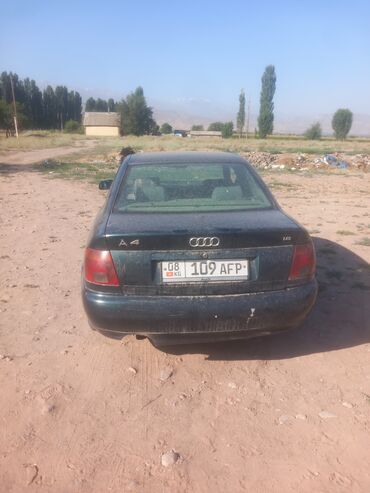 самые дорогие машины в кыргызстане: Седан Audi A4 в черном цвете с четырехдверным кузовом. На задней части