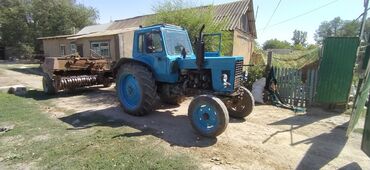 Тракторы МТЗ (Беларус): Трактор МТЗ «Беларус» с кабиной, сзади трехточечная навеска и ВОМ — 12