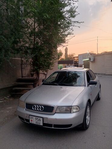 ауди 100 рассрочка: Серебристый седан Audi A4 с люком на крыше. Автомобиль оснащен литыми