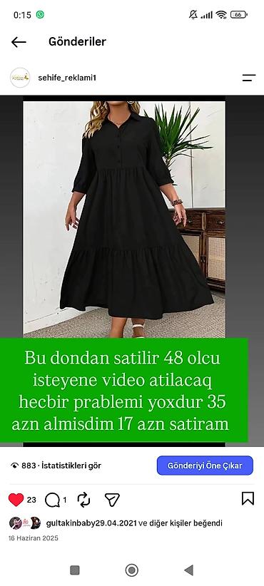 Qara rəngli, uzun və sərbəst kəsimli qadın donu. - Ölçü: 48 - Dizayn