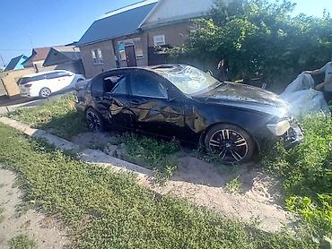 e53 amg: BMW 7 Series 740Li, чёрный седан (длинная база). На фото — автомобиль — 1