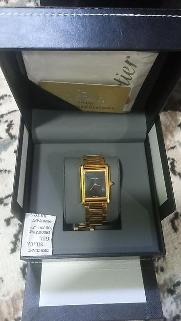 Aksesuarlar: Brend: Cartier (qutu və aksesuarlarla) Model: Düzbucaqlı kadranlı — 5