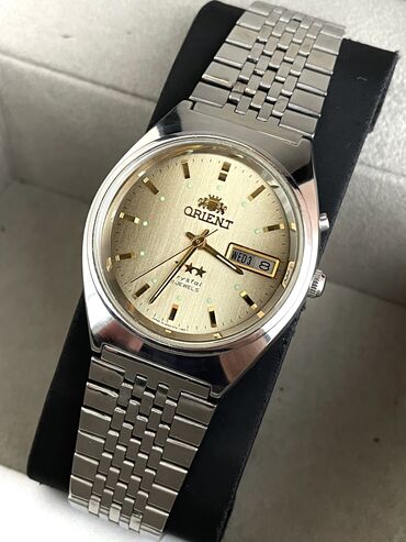 Qol saatları: İşlənmiş, Qol saatı, Orient, rəng - Qızılı — 1