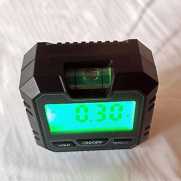 Laserski daljinomeri: Nov digitalni uglomer. Ima sa donje strane magnete, ima dugme da — 9