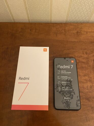Xiaomi: Xiaomi Redmi 7, 16 GB, rəng - Qara, 
 Sensor, Barmaq izi, İki sim kartlı