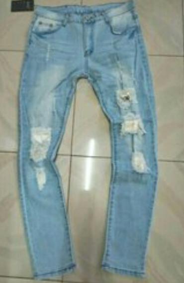 Cinslər: Məhsul: Açıq mavi rəngli cins şalvar - Stil: Cırıq və yırtıq detallı — 1