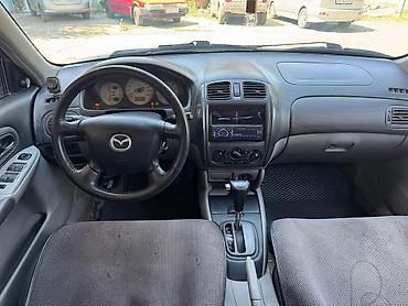 миша: Mazda Familia: 2002 г., 1.6 л, Механика, Бензин, Седан — 5