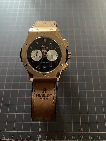 saat alanlar: İşlənmiş, Qol saatı, Hublot, rəng - Qızılı — 1