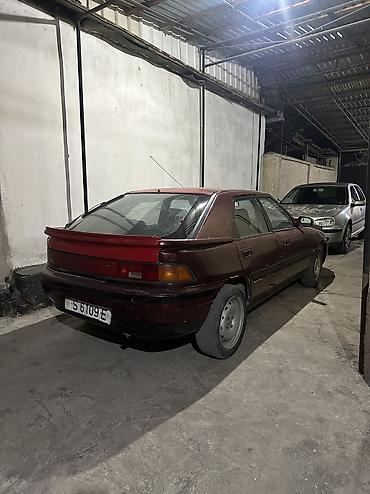 e38 bmw: Mazda 323: 1993 г., 1.6 л, Механика, Бензин, Хэтчбэк — 1