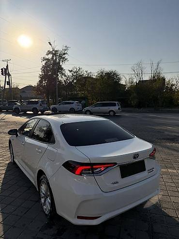 2023 kia ev5: Toyota Corolla: 2020 г., 1.8 л, Вариатор, Гибрид, Седан — 5