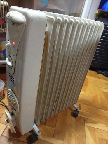 Uljani radijatori: Ulje­ni radijator Midea sa 12 rebara i ispravnim ventilatorom - Tip — 6