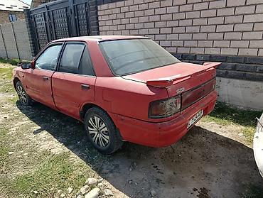 Mazda: Mazda Familia: 1992 г., 1.6 л, Кол менен иштөөчү, Бензин, Седан — 5
