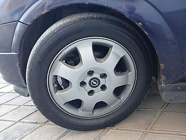 Şin və təkərlər: Opel üçün orijinal 16 olculu təkər diski və təkər komplekti - Disk — 1