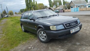 дополнительное освещение на авто: Универсал Audi A6 черного цвета. Модель оснащена рейлингами на крыше