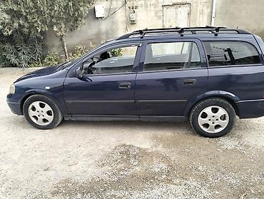 prius baqaj: Opel Astra Caravan (universal) – tünd mavi rəng. Xüsusiyyətlər: - — 5