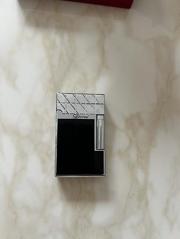 Digər aksesuarlar: Derui butan qazlı premium alışqan - Brend: Derui (www.rf-lighter.com — 2