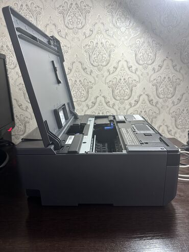 Принтеры: Epson L8058 новый на 98 процентов 1. **Epson L8058: Печать, которая