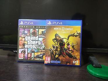 видио игры: Игровая консоль PlayStation 4 Slim (черная) с двумя беспроводными — 2