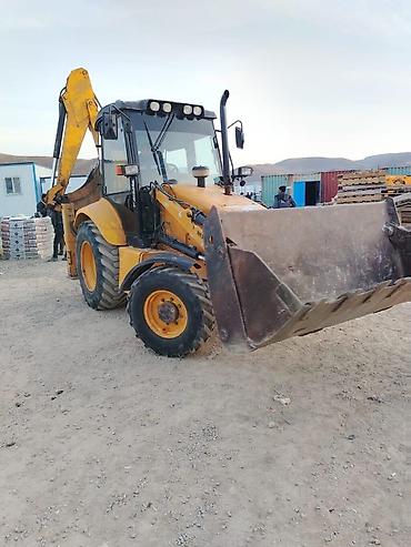 ekskavatör: New Holland ekskavator-yükləyici - Marka/model: New Holland (bekhoe — 2