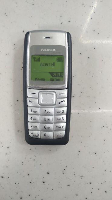 nokia 2010: Nokia C110, цвет - Серебристый, Гарантия, Кнопочный