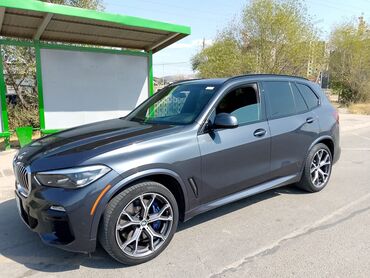 молдинг бмв е39: Полноразмерный кроссовер BMW X5 в цвете "серый металлик" с характерной