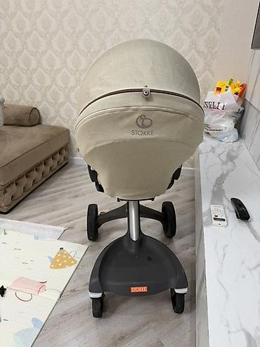 коляски анекс бу: Stokke brendi. 2300 azn alinib yeni kimi qalib. Tutacaqi yuxarida — 4