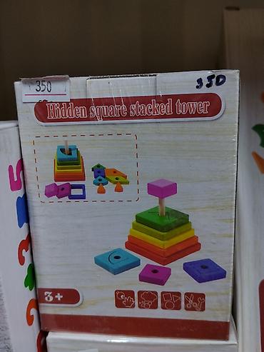 пирамидки: Деревянная развивающая пирамидка Hidden Square Stacked Tower. - Набор — 1