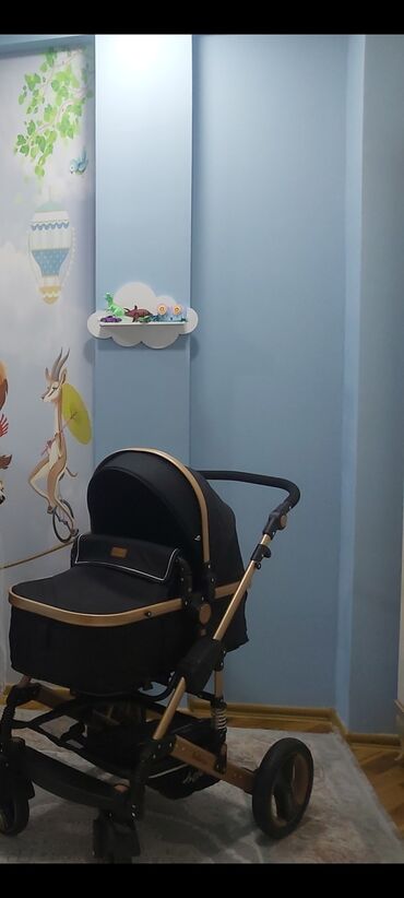 Manejlər: Uşaq arabası – qara rəngli beşik tipli (carrycot) model