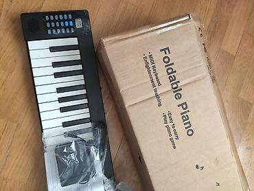 pianolar: Məhsul: Yığıla bilən rəqəmsal piano (Foldable Piano) Xüsusiyyətlər: - — 1
