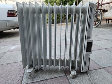 pec radiatoru: Radiator yagla işləyir kaıarifiıidə var əla vəziyyətdə təkərinin biri