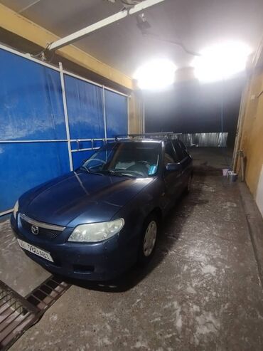 машина лейлек: Mazda Familia: 2001 г., Бензин, Седан