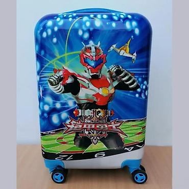 Rančevi, torbe i koferi: Dečiji putni kofer sa upečatljivim dizajnom crtanog junaka. Kofer je — 1