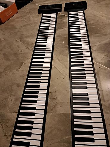 Musiqi alətləri: Daşınan qatlanan rəqəmsal piano (roll-up keyboard) Maya deyerine — 8
