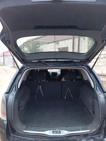Opel: Opel Astra H Caravan (Universal) – qara rəng, salon və yük yeri geniş — 3