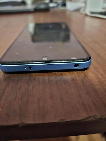 Мобильные телефоны и аксессуары: Redmi 12, 128 ГБ, цвет - Голубой, Отпечаток пальца, Face ID — 1