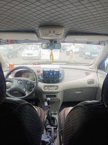 диск на мотоцикл: Представлен серебристый хэтчбек Nissan Almera, отличающийся