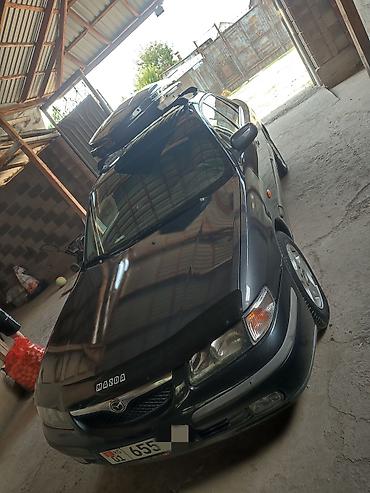 мотор майы: Mazda 626: 1999 г., 1.8 л, Кол менен иштөөчү, Бензин, Седан — 3