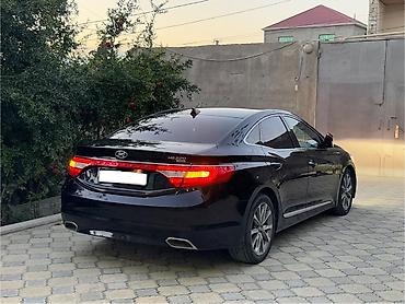 mitsubishi lancer evolution: Hyundai Grandeur: 2.2 l | 2015 il Sedan — 5