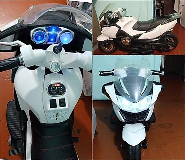 oyuncaq bebe: Uşaq üçün elektrik motosikleti – ağ/qara rəngdə sport dizayn — 1