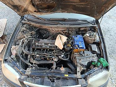велоприцеп для детей: Mazda 323: 2002 г., Механика, Дизель, Хэтчбэк — 1
