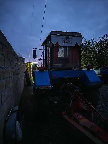 tap.az avtomobiller: Mavi rəngli kabinalı təkərli traktor - Ön kranklı, ikili dəyirmi — 3