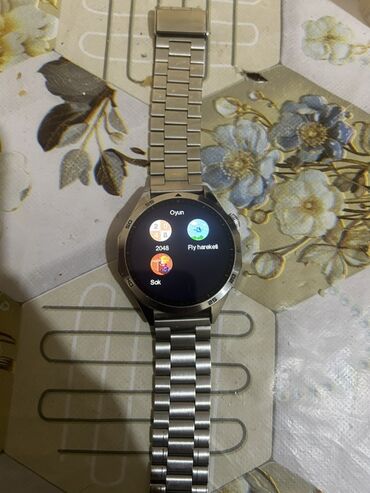 Smart saatlar: Metal qayışlı, dairəvi displeyli ağıllı saat. Xüsusiyyətlər: - Tam — 9