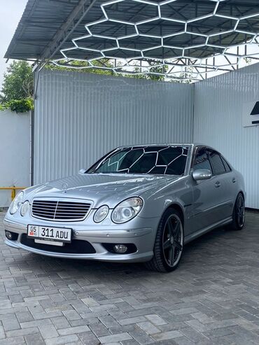 мерседес с класс цена: Серебристый седан Mercedes-Benz E-класса, оснащенный элементами