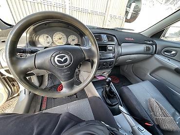 Mazda: Mazda 323: 2003 г., 1.6 л, Бензин, Универсал — 11